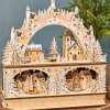 14.75" Lighted Laser Cut Wood Village Scene with Moving Figurine and Candles