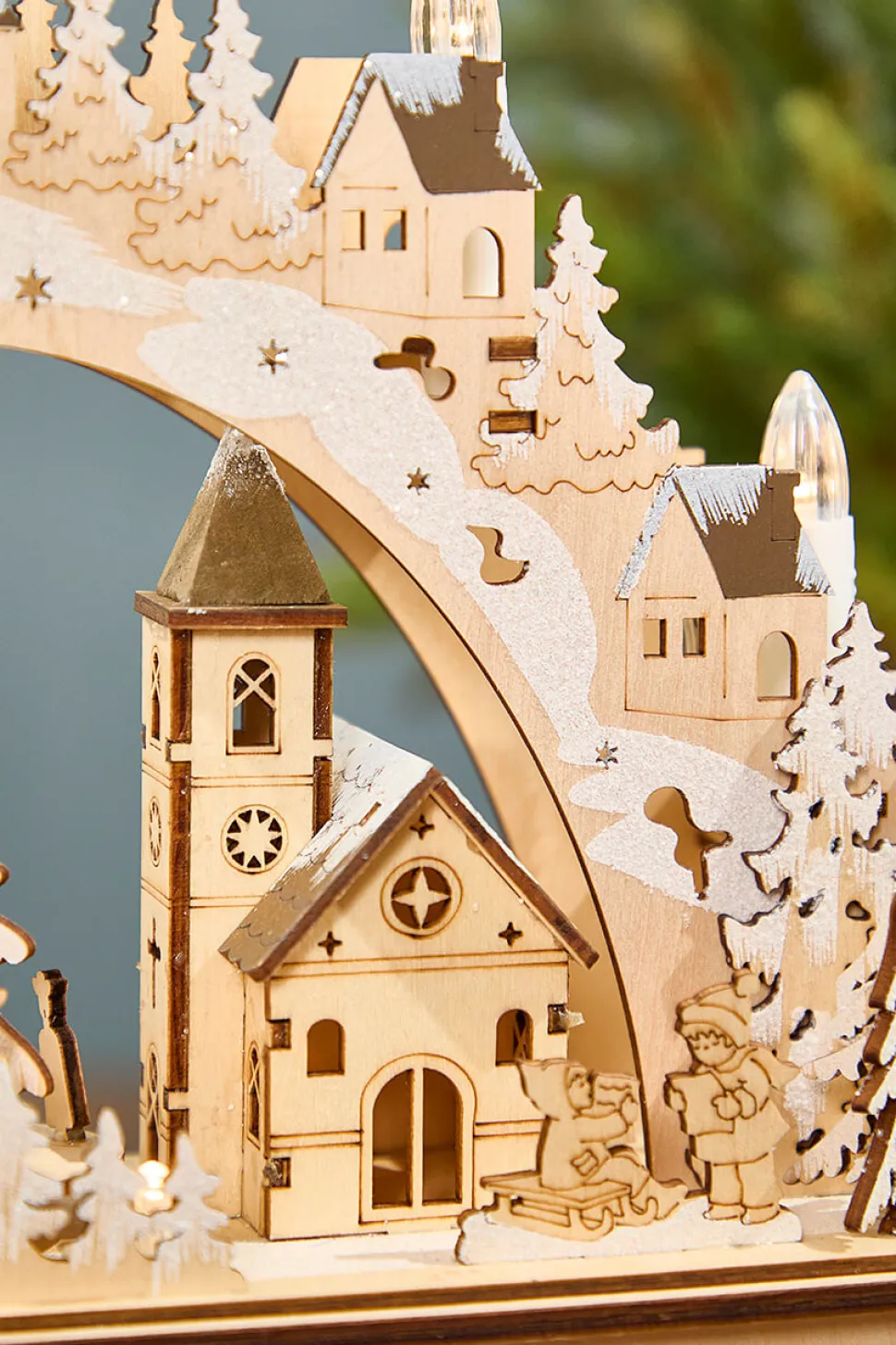 14.75" Lighted Laser Cut Wood Village Scene with Moving Figurine and Candles